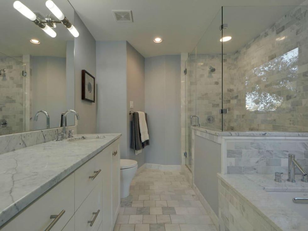 Trendy Travis Heights home offers tree house views and a touch of