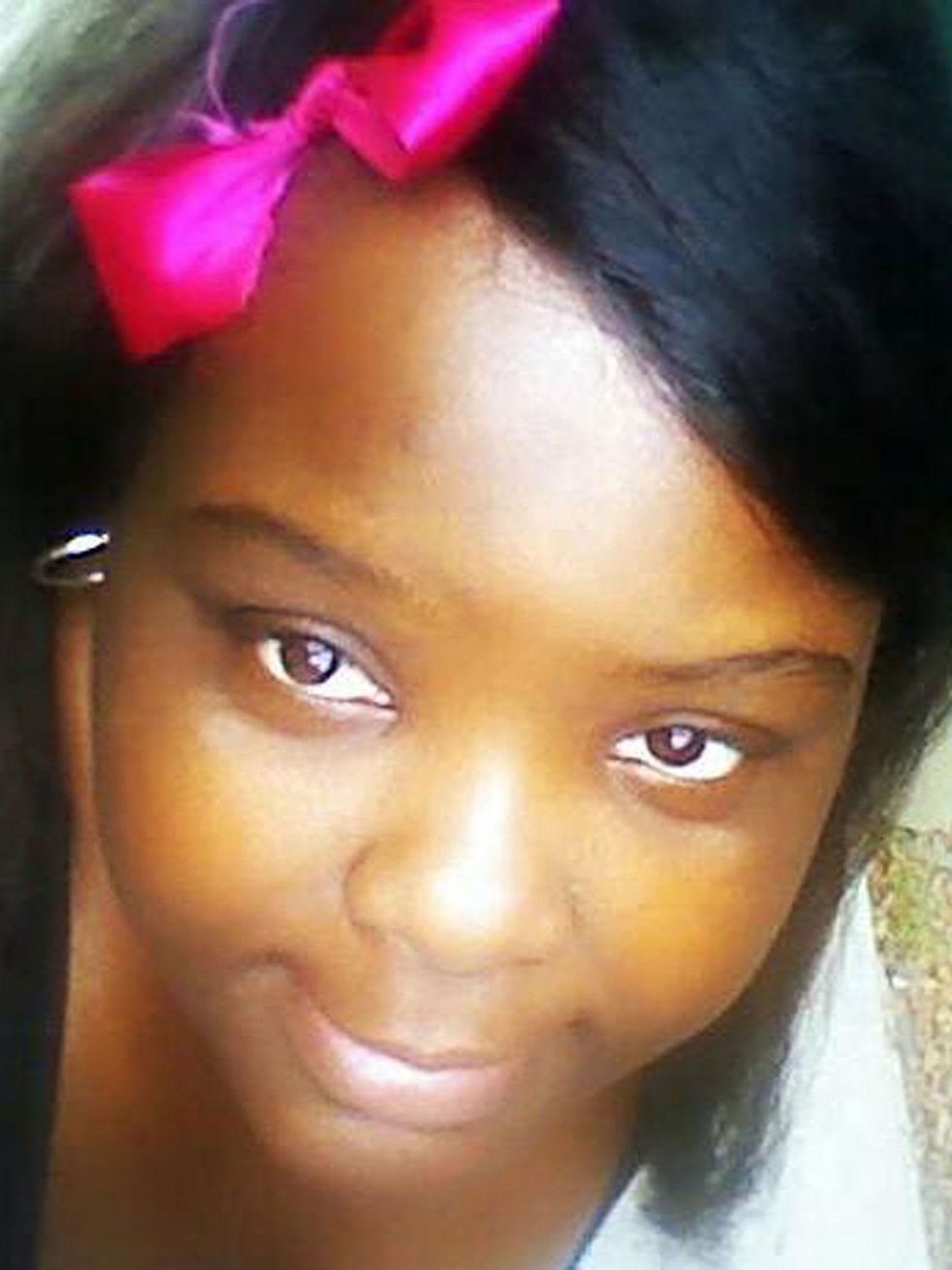 34-year-old Charity Johnson poses as 15-year-old student May 2014 with pink bow