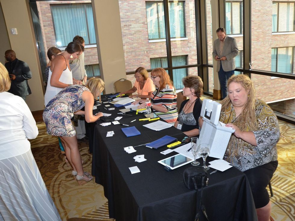 4th Annual Pay it Forward Benefit with Daniel Curtis in Austin Volunteers at registration table