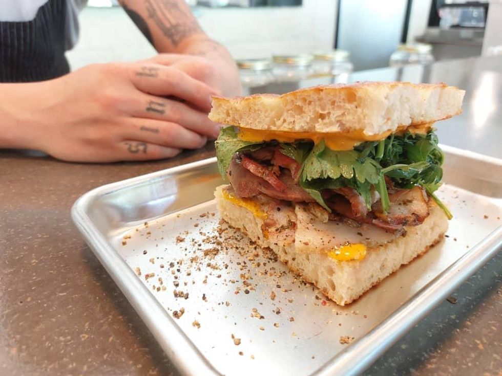 A foccaccia sandwich on a steel counter