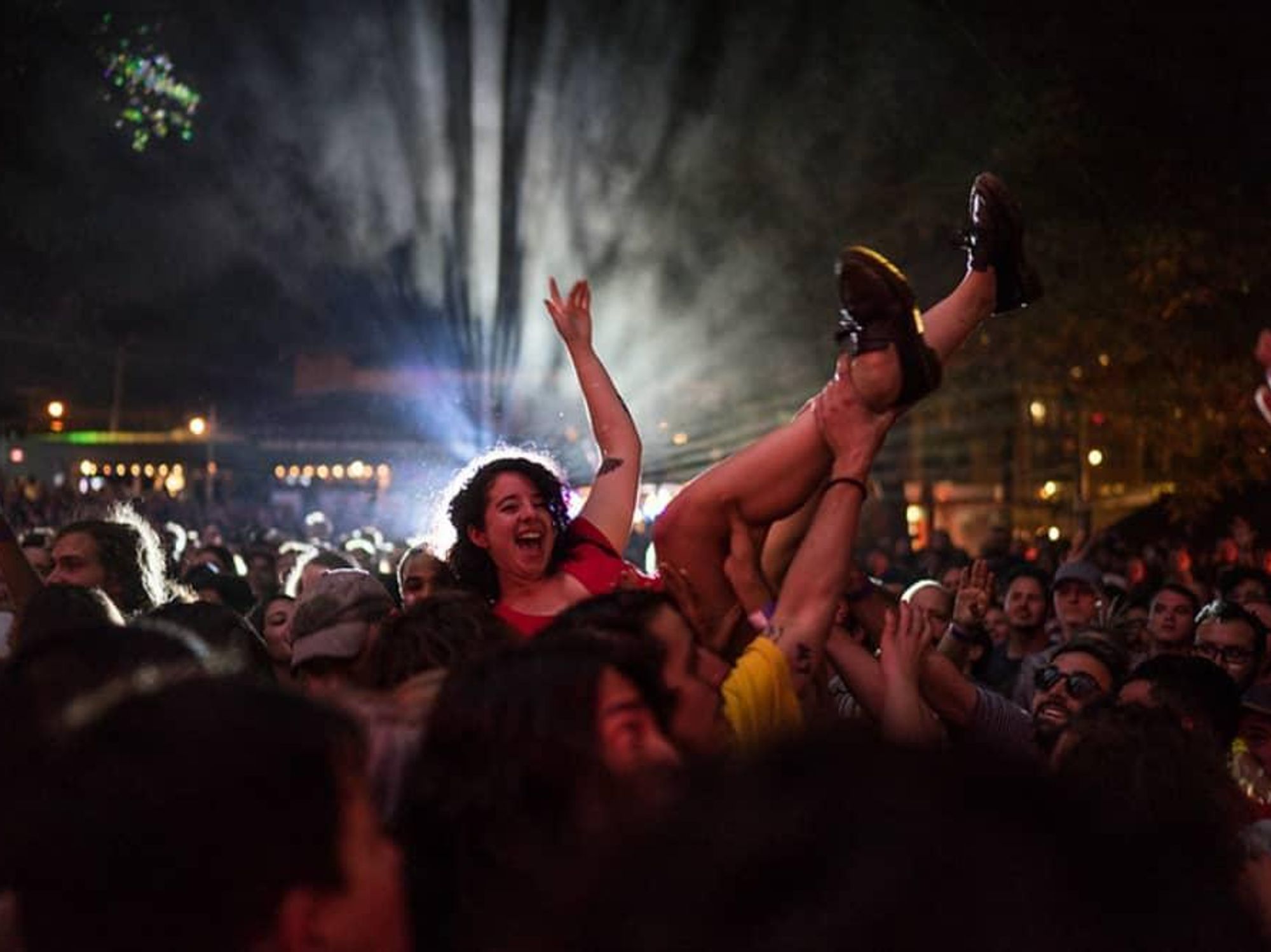 A music fan goes crowd surfing at Levitation.