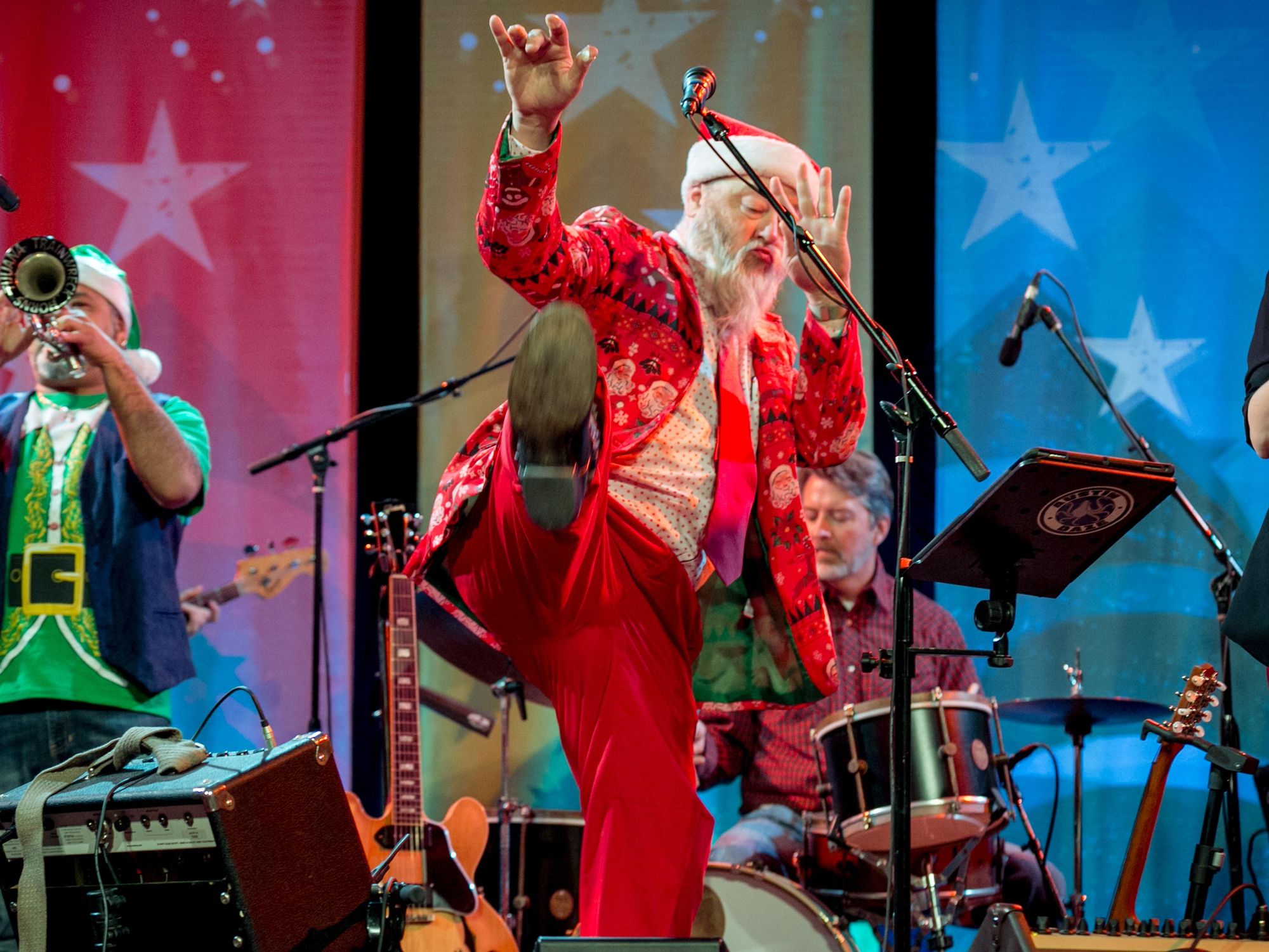 A musician dressed as Santa at the Armadillo Christmas Bazaar in Austin