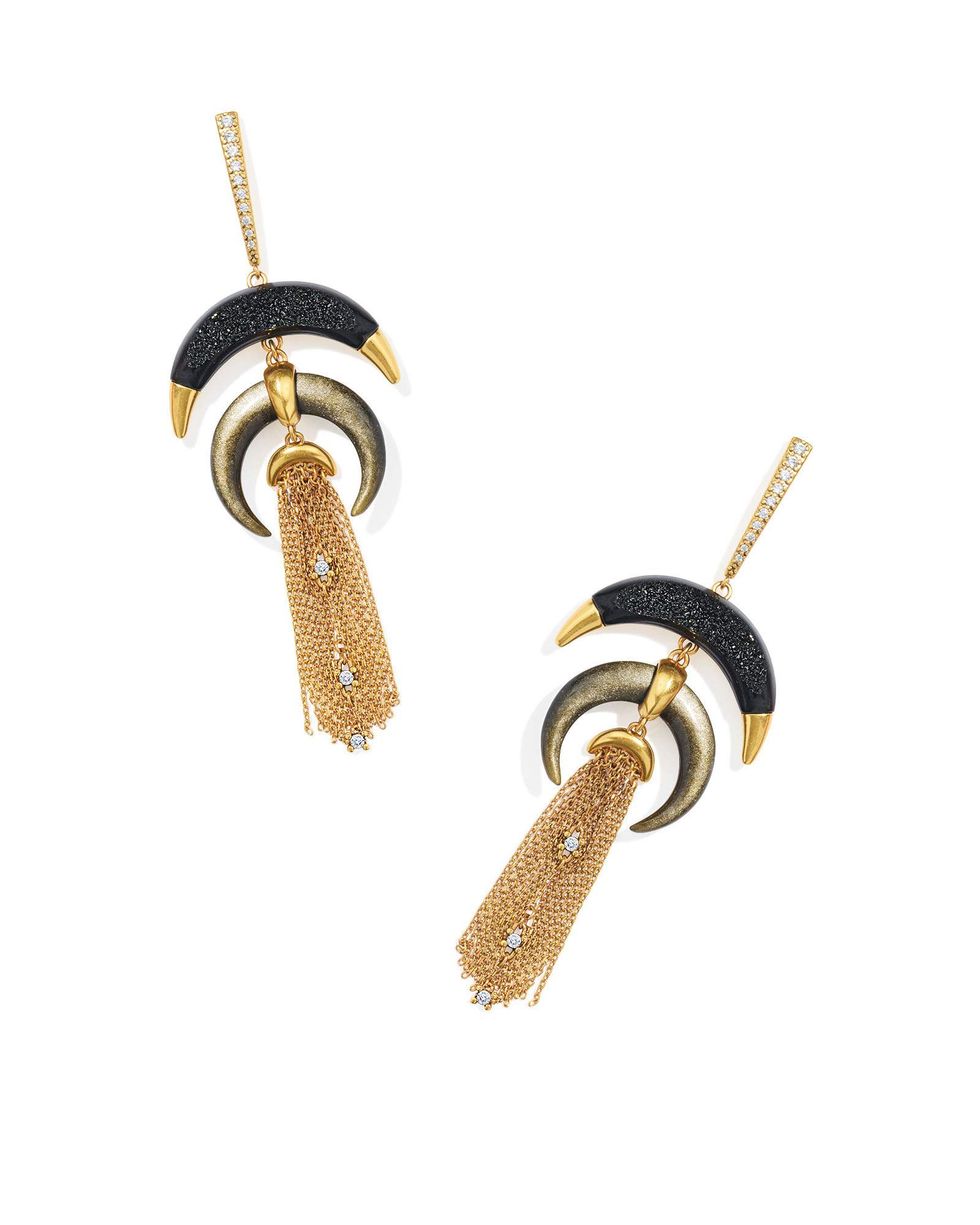 A pair of earrings with black moon-shaped pendants and gold chain fringe, from the Yellow Rose x Kendra Scott by Lainey Wilson collection