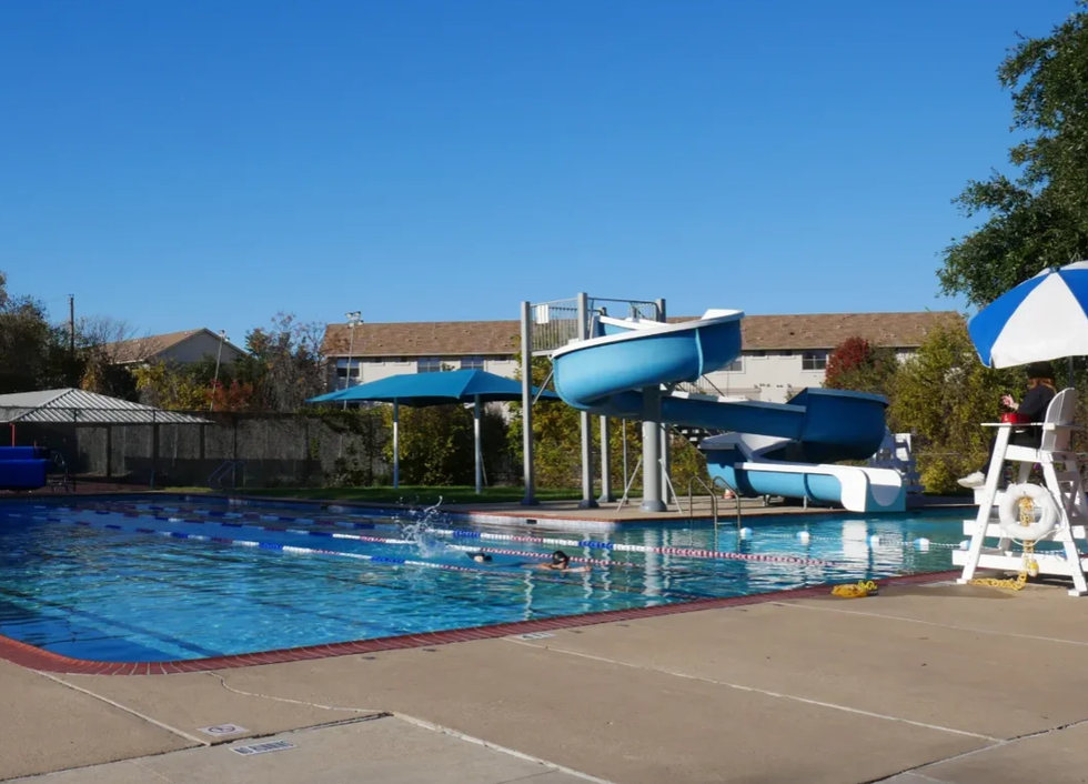 A swimmer does laps in Springwoods Pool in North Austin.