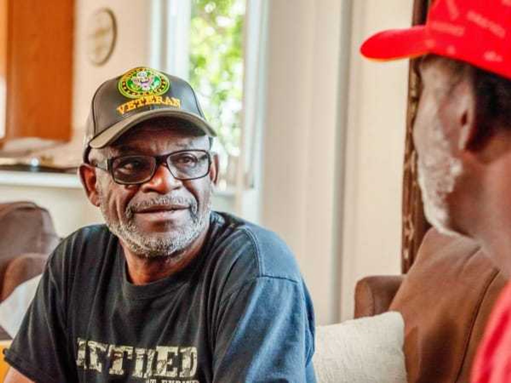 A veteran having a conversation in his home