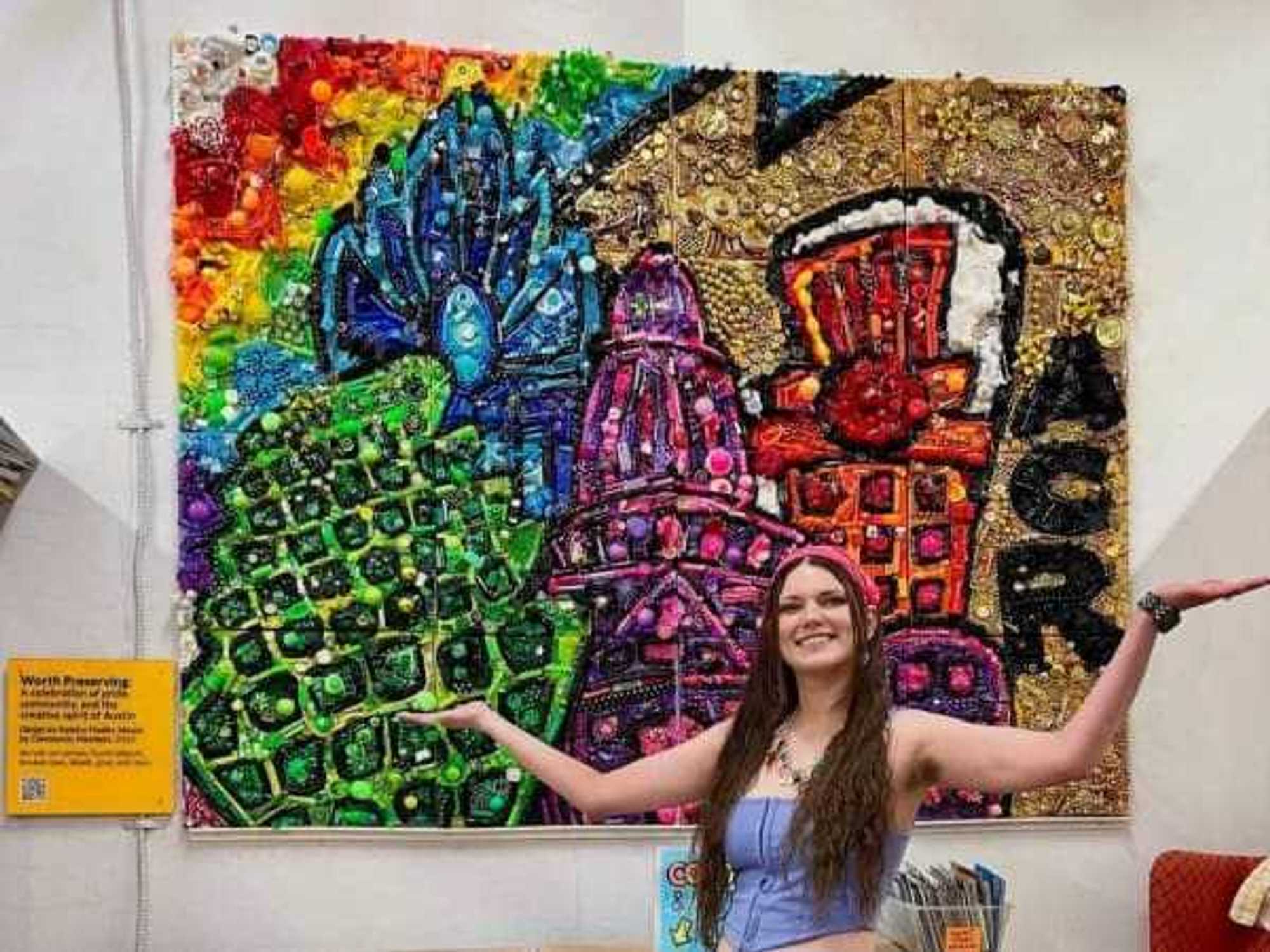 ACR staff member Katelyn Fiedler with community mosaic