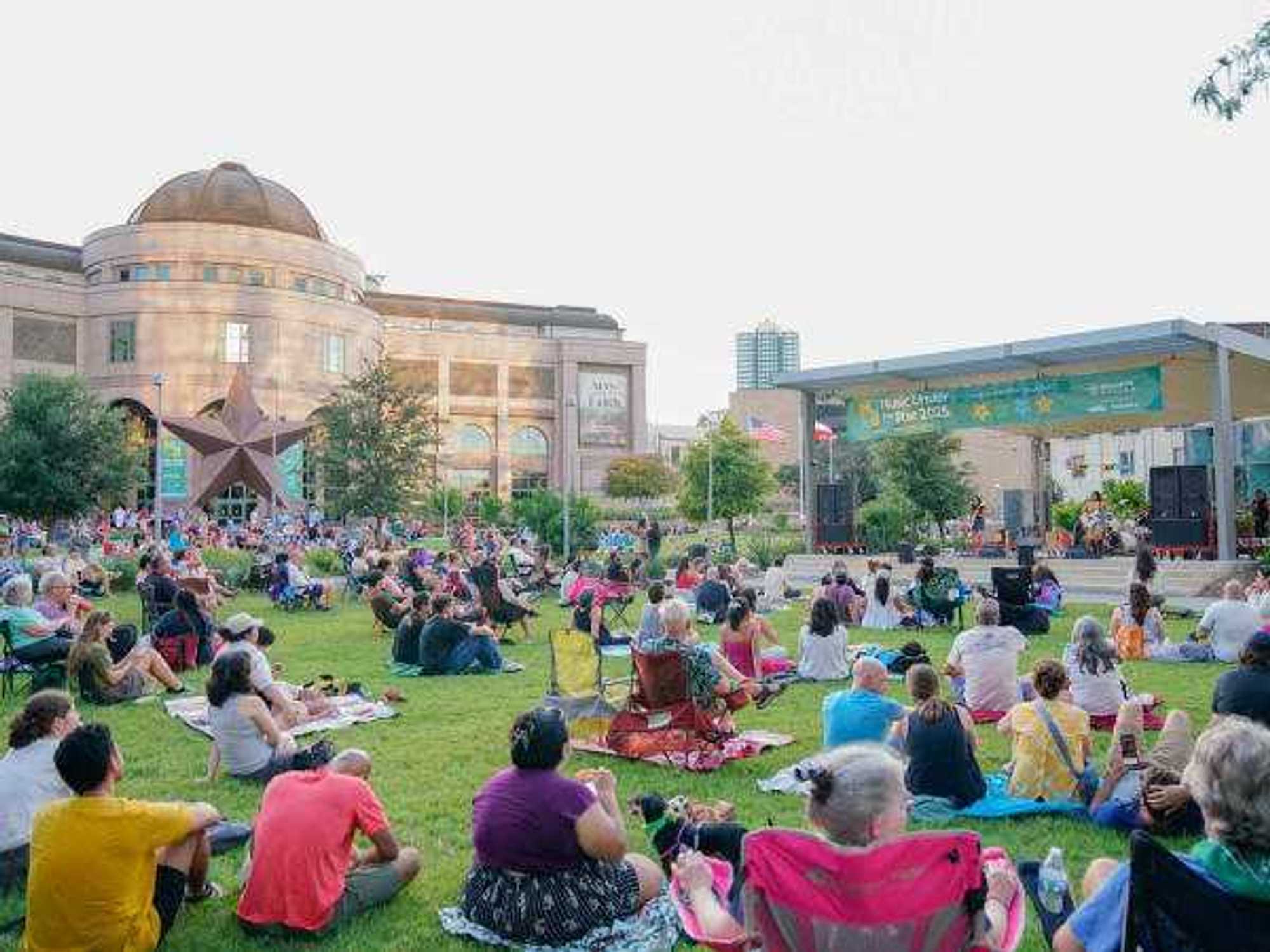 Audience watching The Tiarras at the Bullock Texas State History Museum, part of the Music Under the Star series
