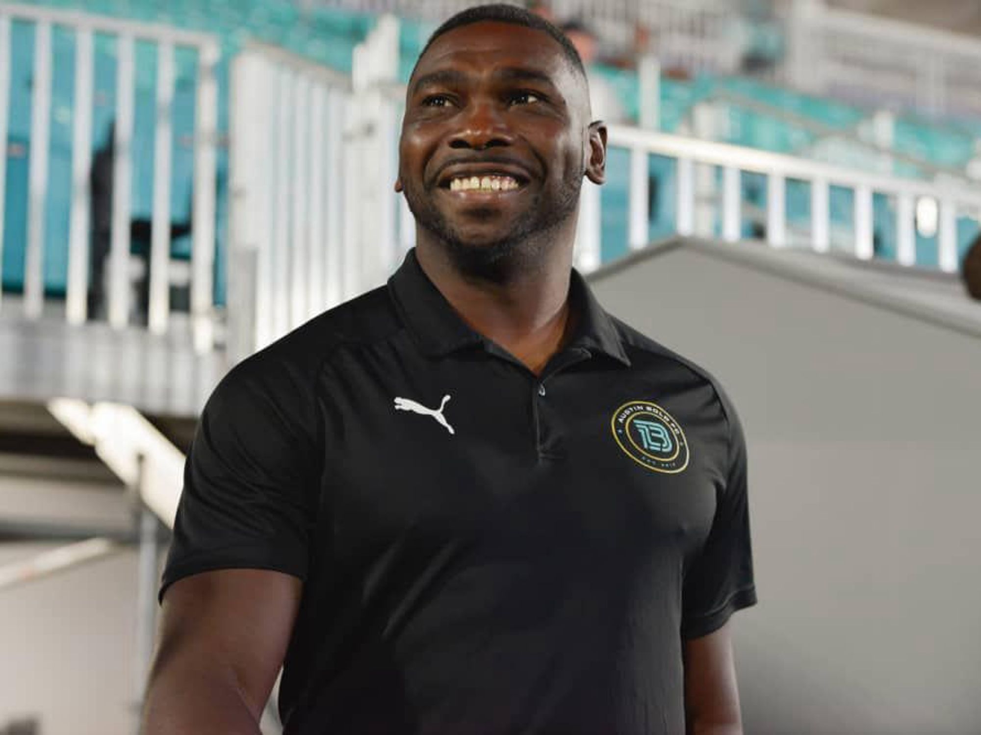 Austin Bold FC head coach Ryan Thompson smiles and makes an entrance.