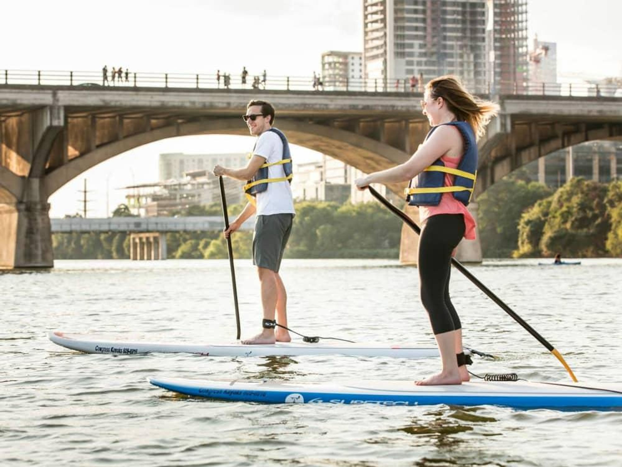 Austin Congress Avenue Bridge paddle board Lady Bird Lake Town Colorado River