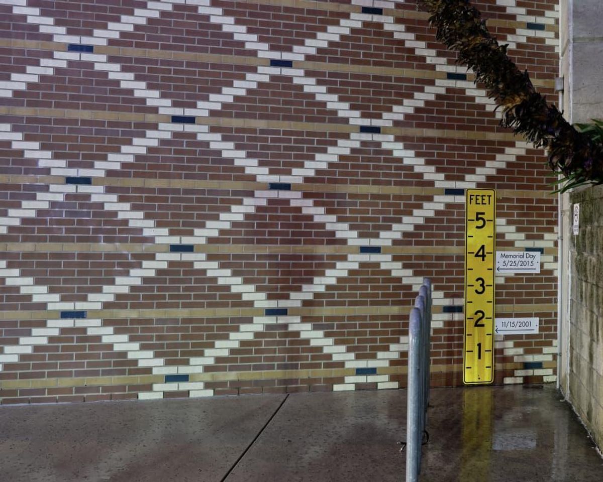 A rain gauge at the GSD&M building shows previous flood levels from May