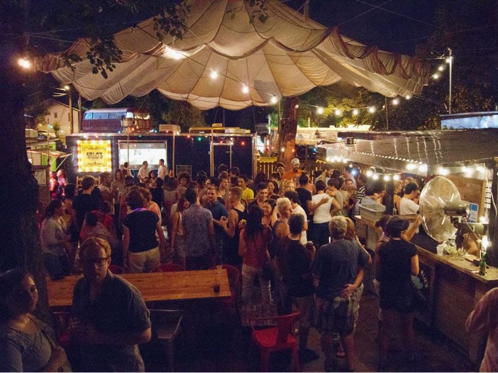 backyard exterior of Cheer Up Charlie's on east sixth with crowd