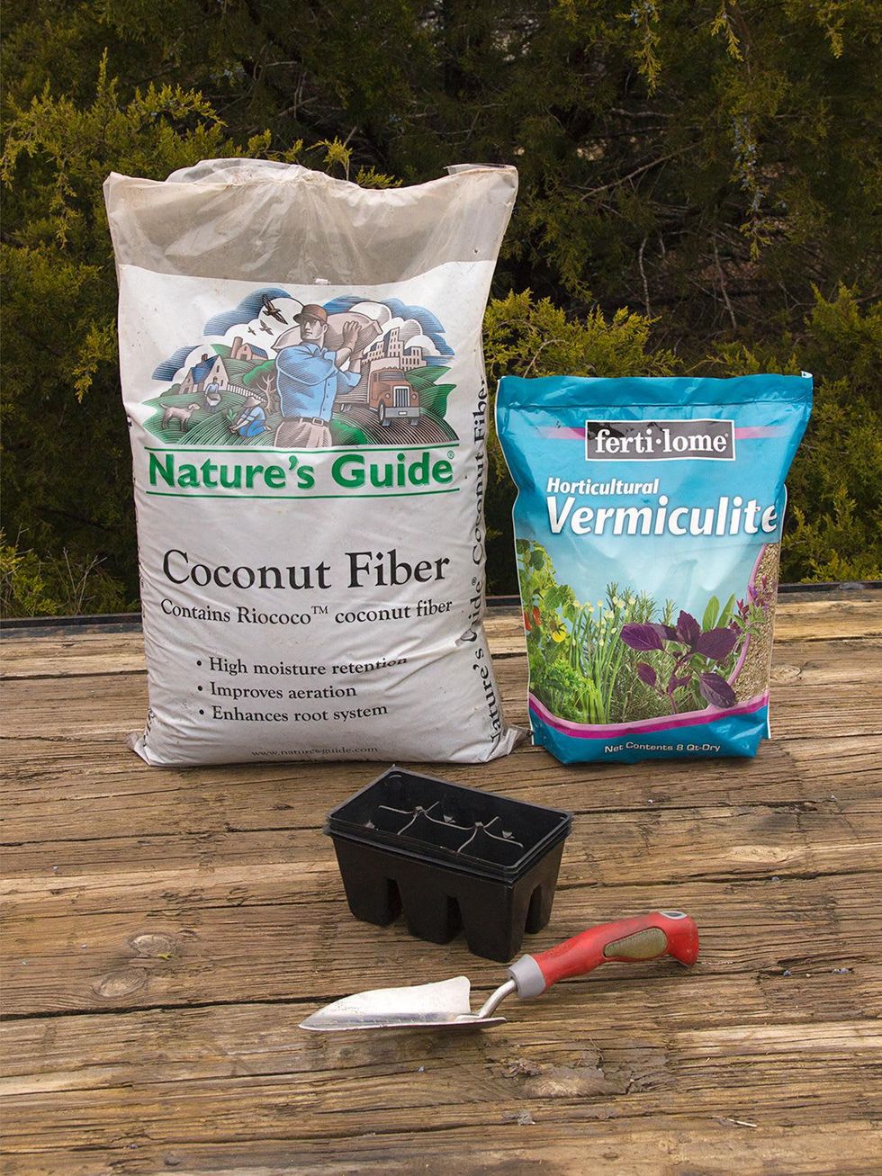 bags of vermiculite and coconut coir with seed starting tools