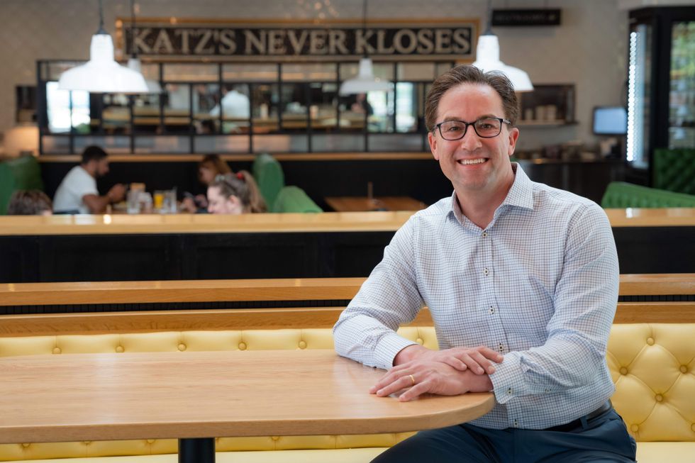 Barry Katz, owner of Katz's, sits at a table in a Houston Katz's restaurant