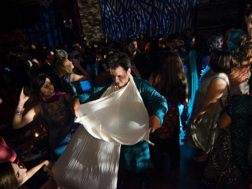 Baruch Garcia dances with his friends at Bollywood Ball