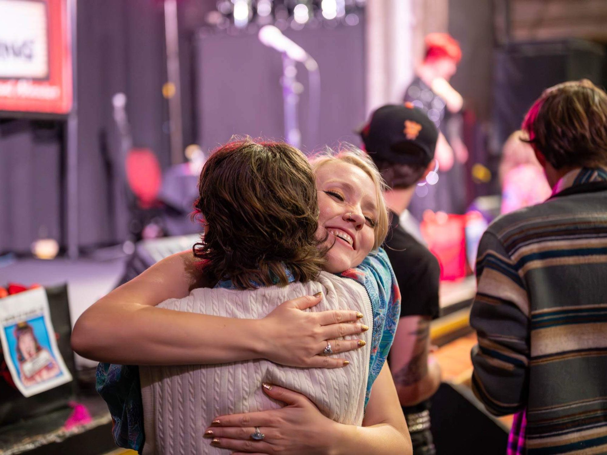 Bawdy Storytelling storyteller hugging audience member