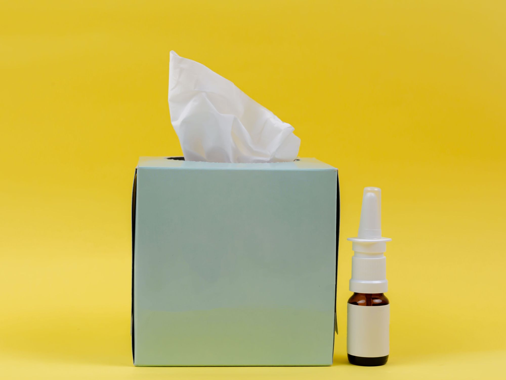 Box of tissues and nasal spray