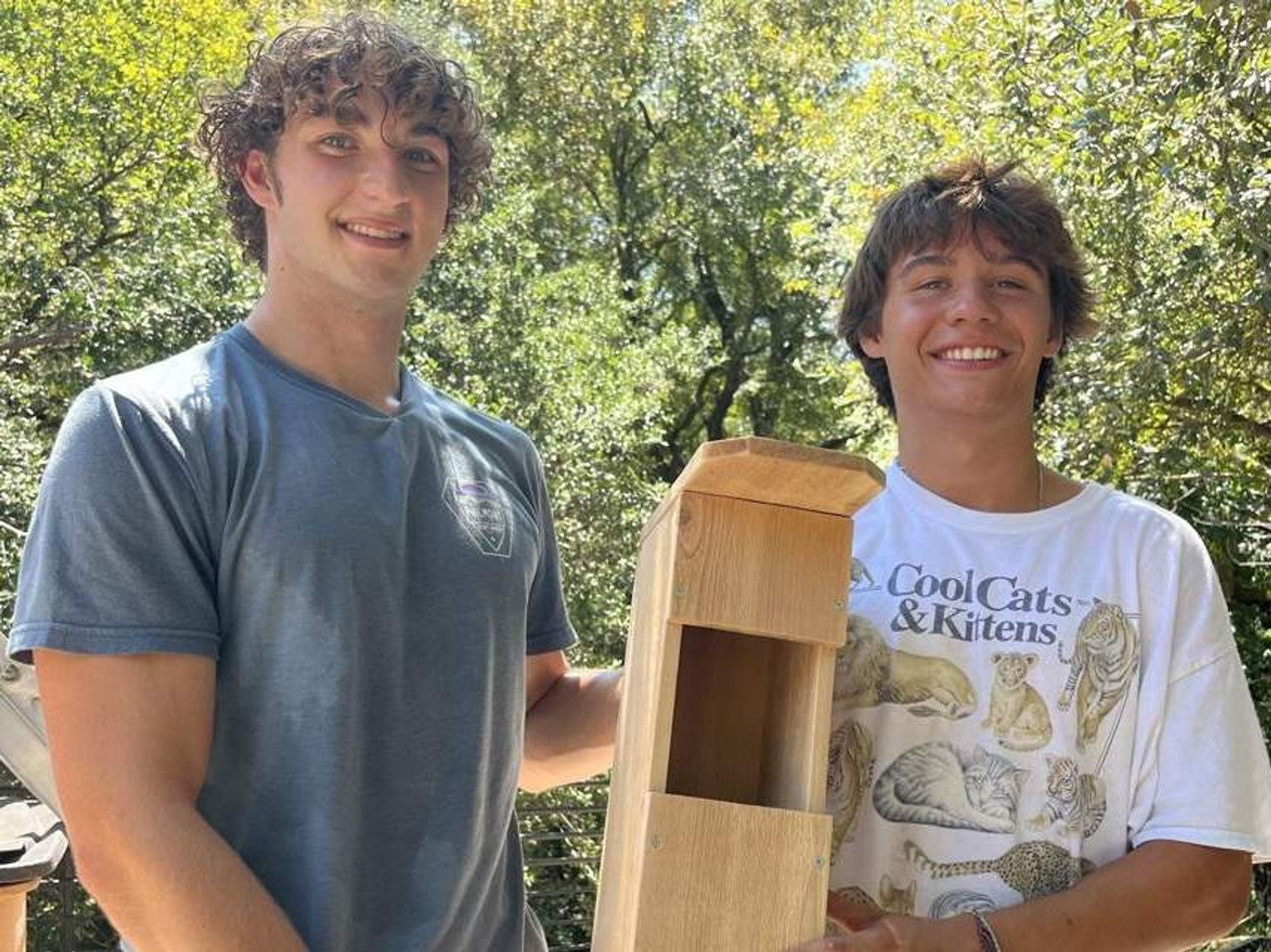 Brady Lauer (left) and Grayton Eustace (right) showing off an owl box