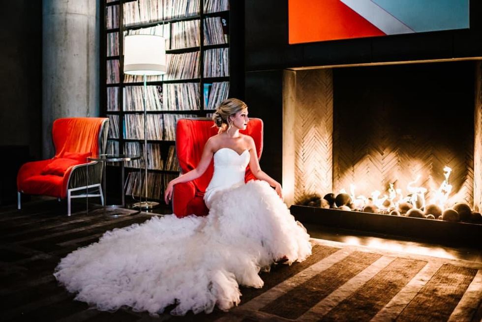 Bride in front of fireplace at W Austin