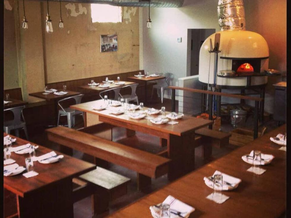 Bufalina pizza restaurant interior with brick oven