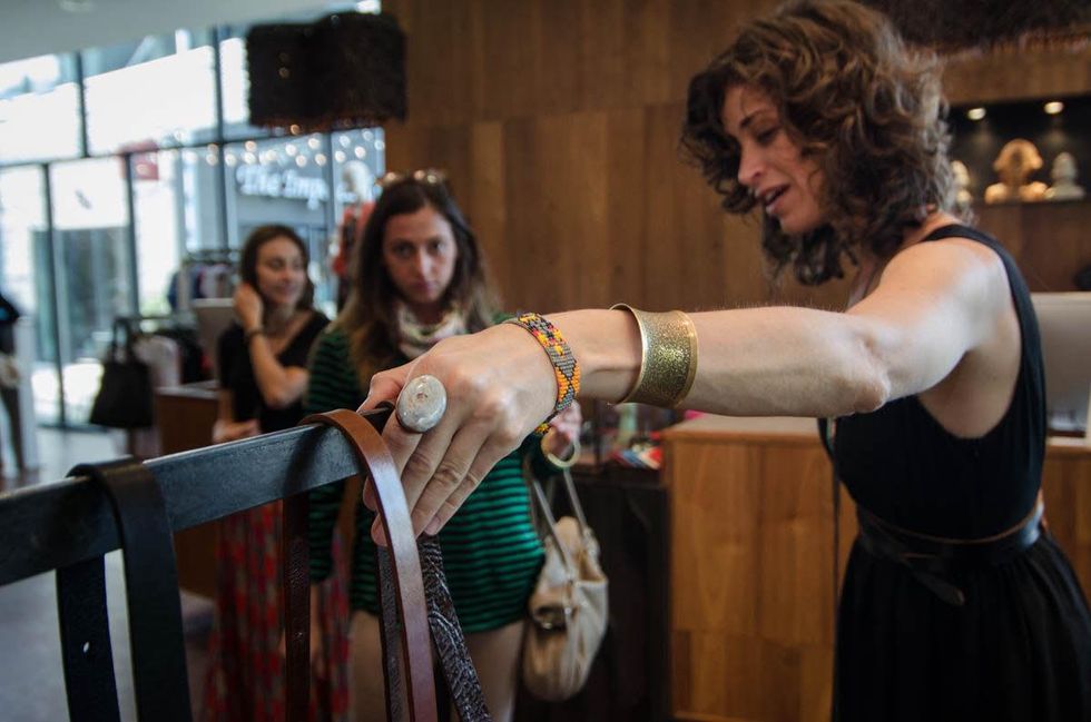 Cambria shows some of her pieces to Cait Potter at By George