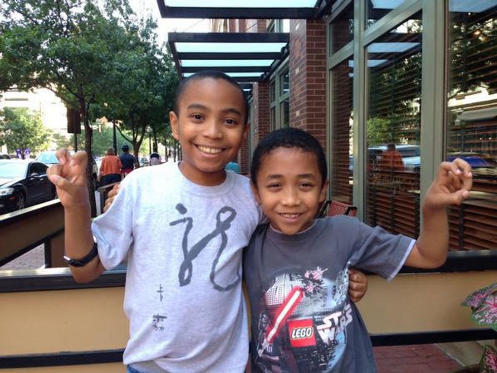 Carson Huey-You the 11 year old student at TCU with younger brother Cannan