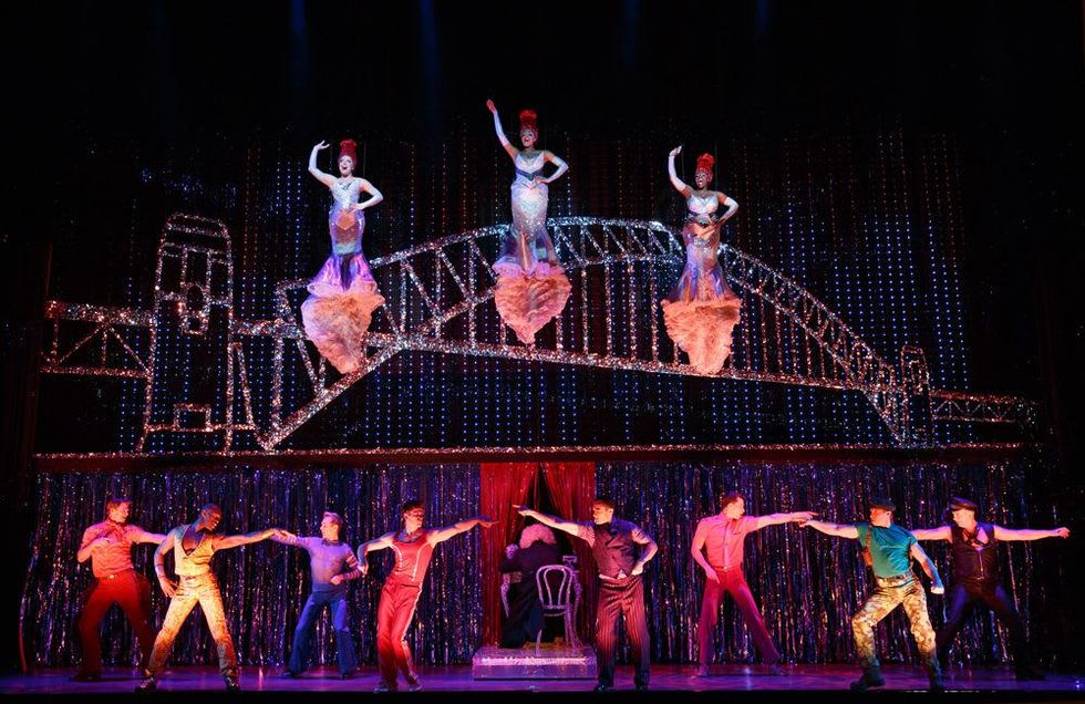 Center left to right (flying): Emily Afton, Brit West and Bre Jackson and Company in the number \u201cIt\u2019s Raining Men\u201d