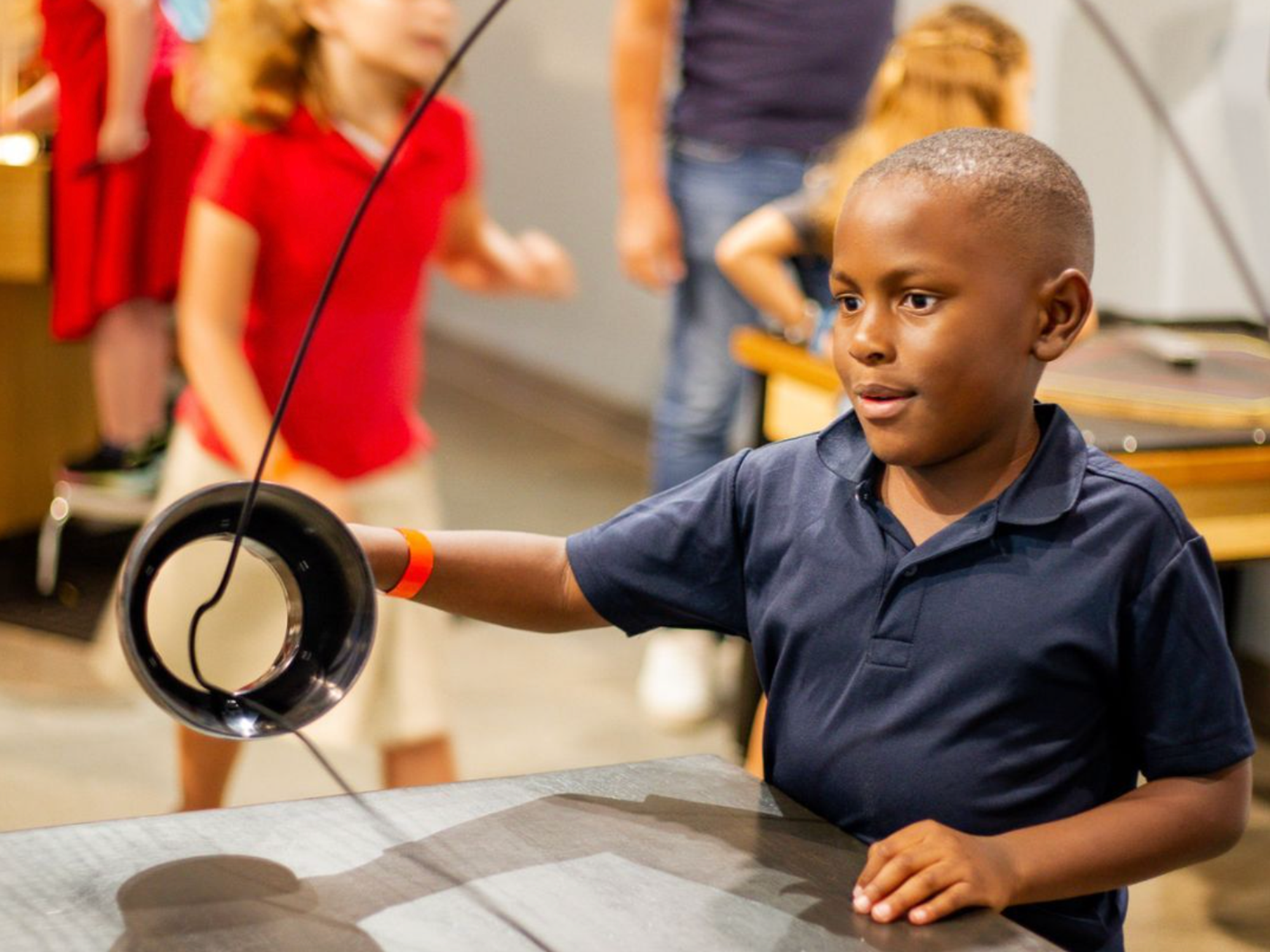Child playing with science toy at Thinkery Austin