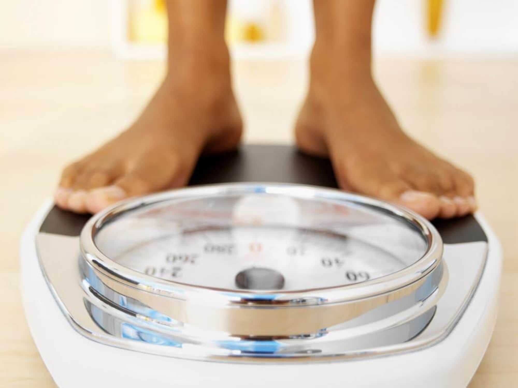 child's feet on a scale