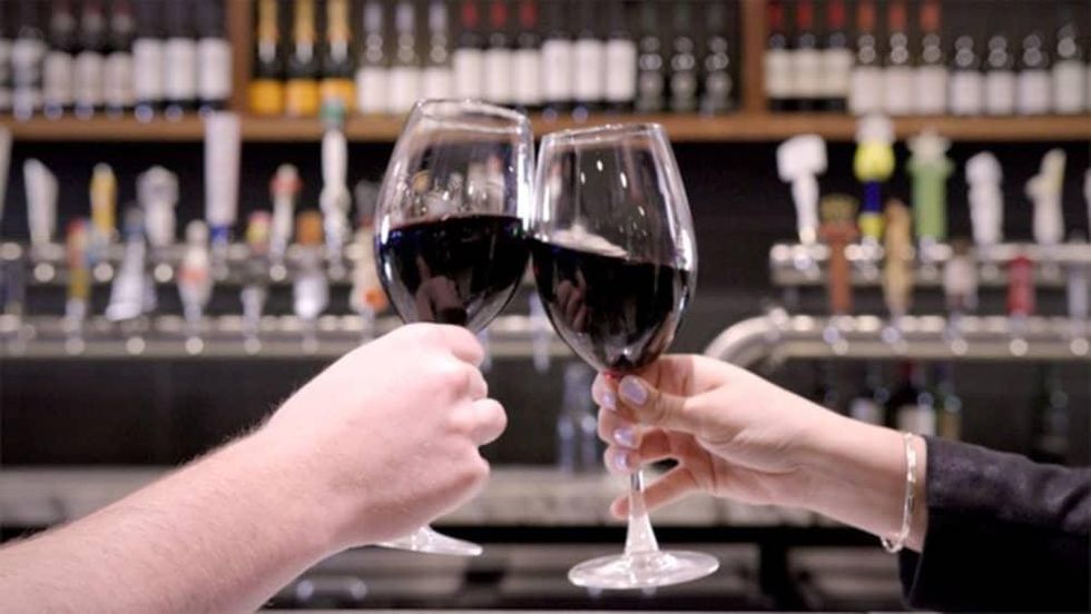 Clinking wine glasses