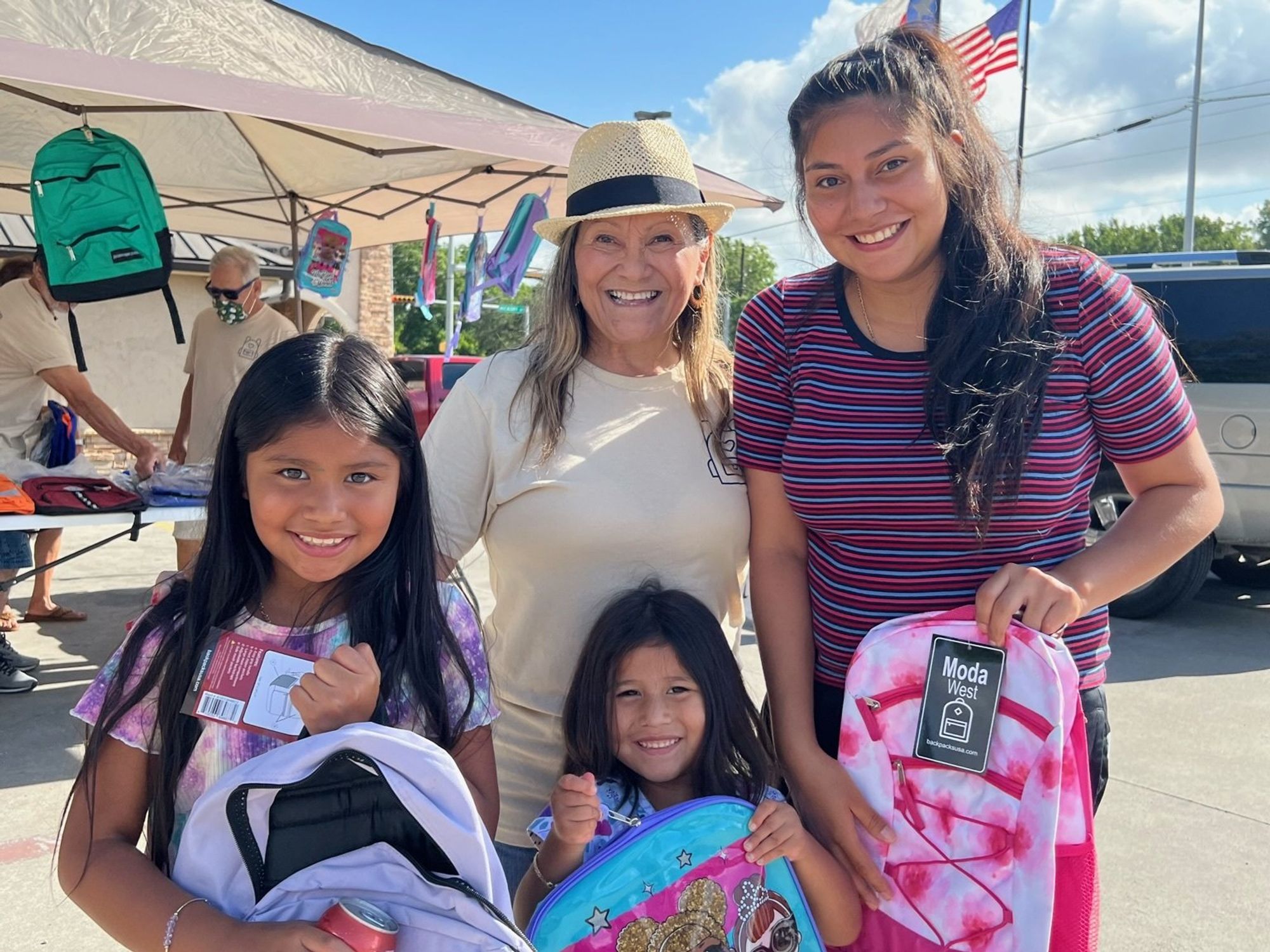 Connie S. Amaya and students with backpacks