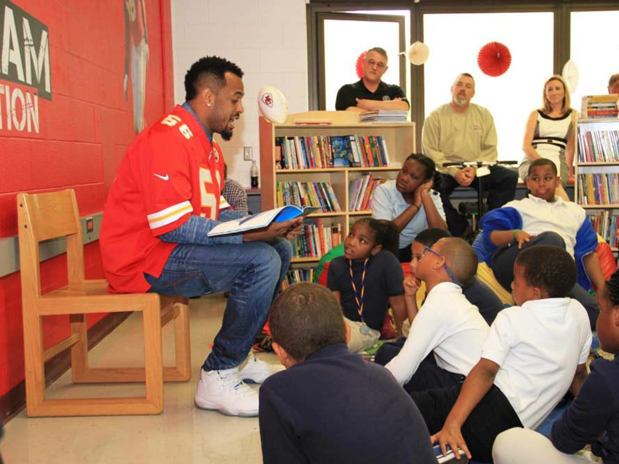Derrick Johnson of Defend the Dream reading in a Discovery Den