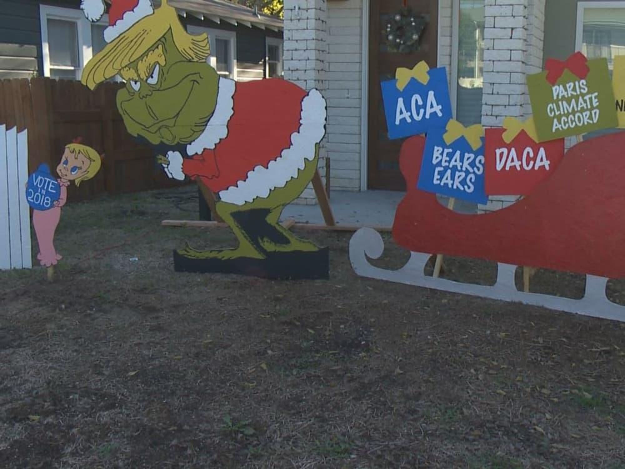 Donald Trump Grinch holiday display Austin