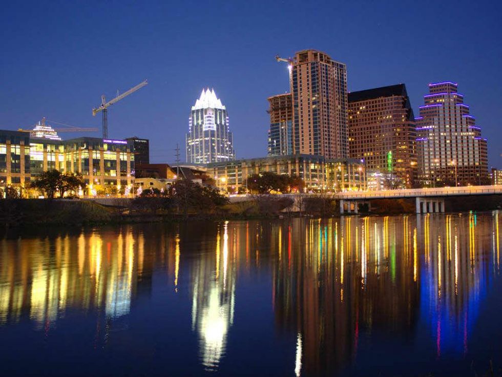 Downtown Austin skyline in the evening across from Lady Bird Lake