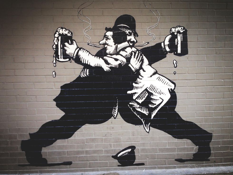 drinking mural outside of The Ginger Man Austin