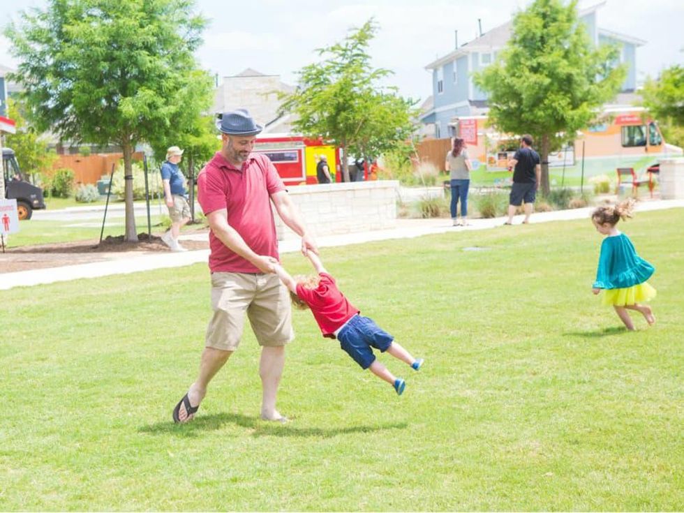 Easton Park dad son kida playing park