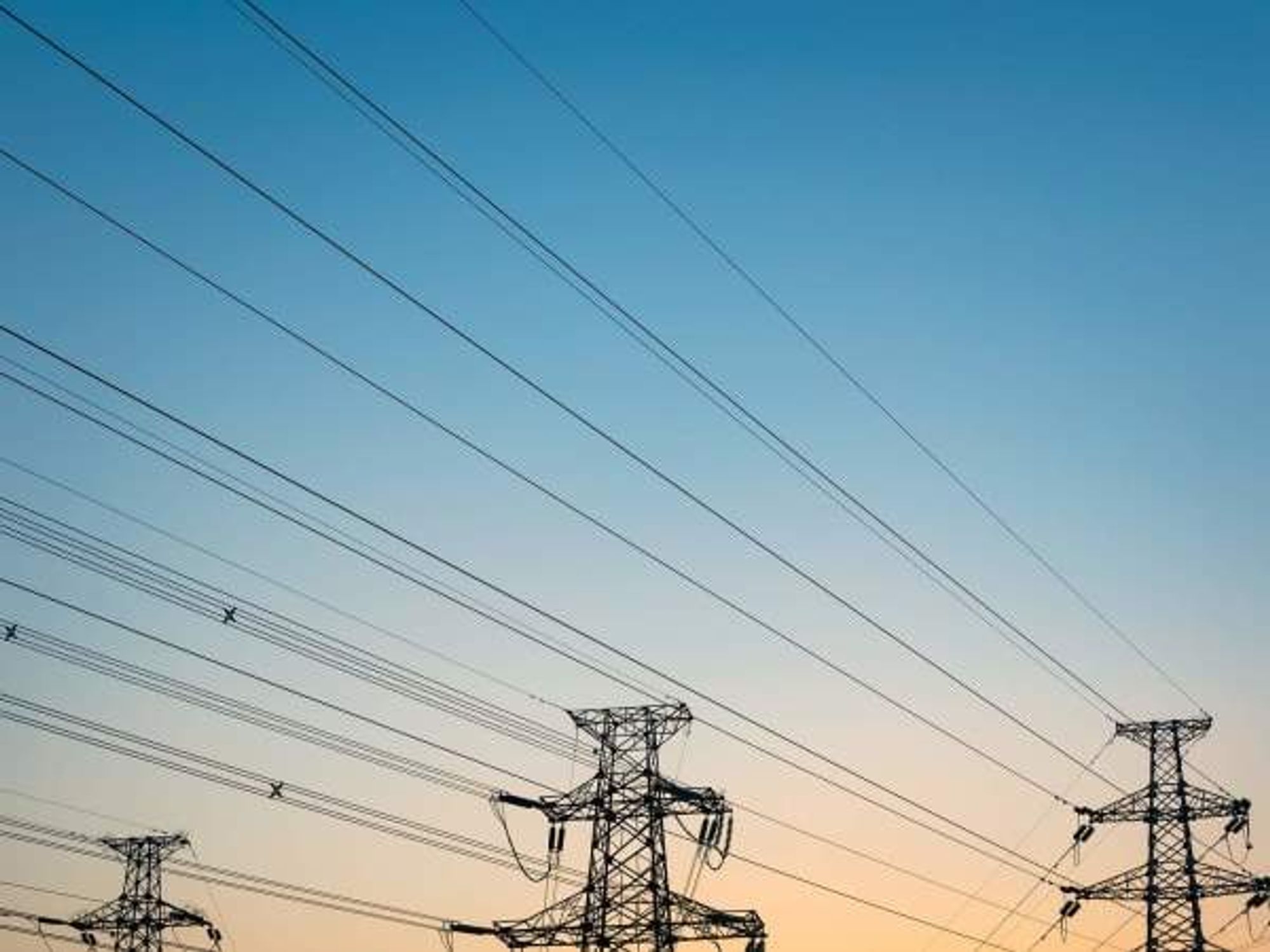 Electric wire towers in the sunset