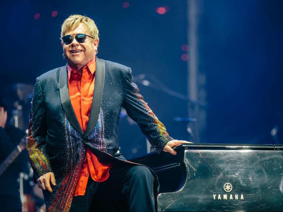 Elton John triumphs over Formula 1's dicey conditions with soaring ...