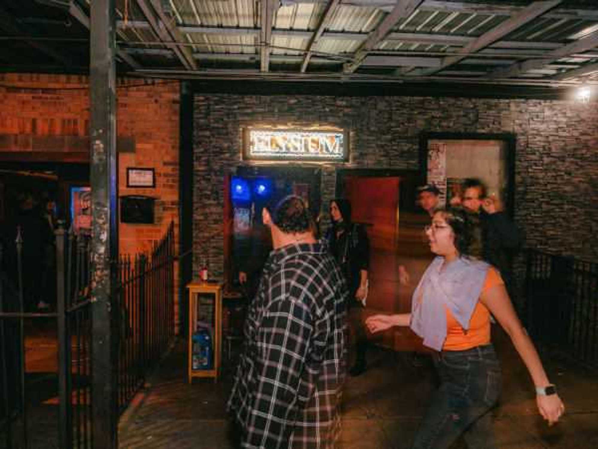 Elysium Austin front door and people walking past