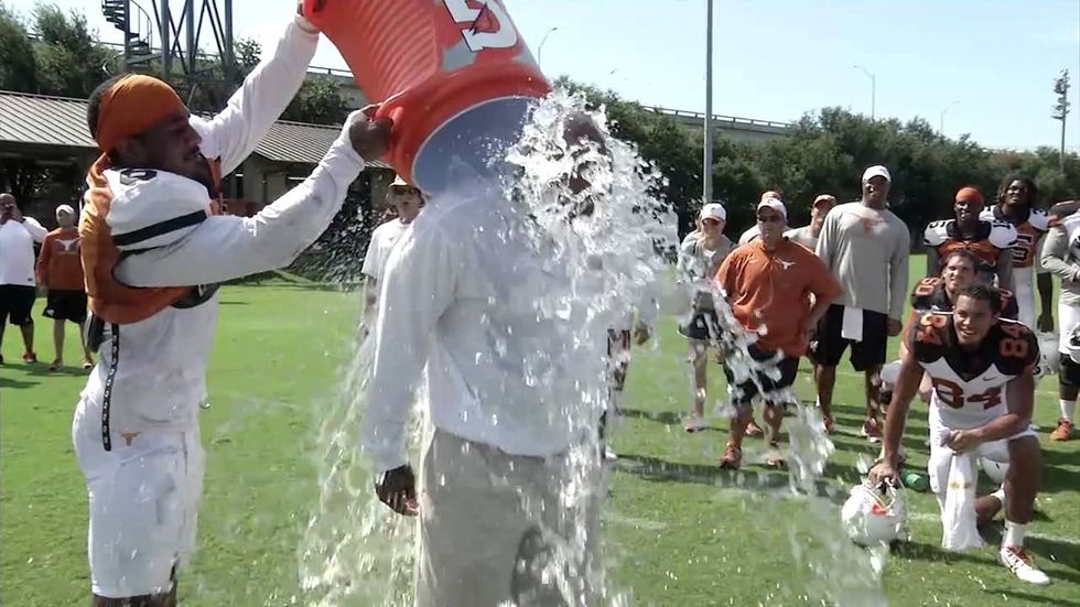 Watch Charlie Strong and Mack Brown take on the viral Ice Bucket Challenge