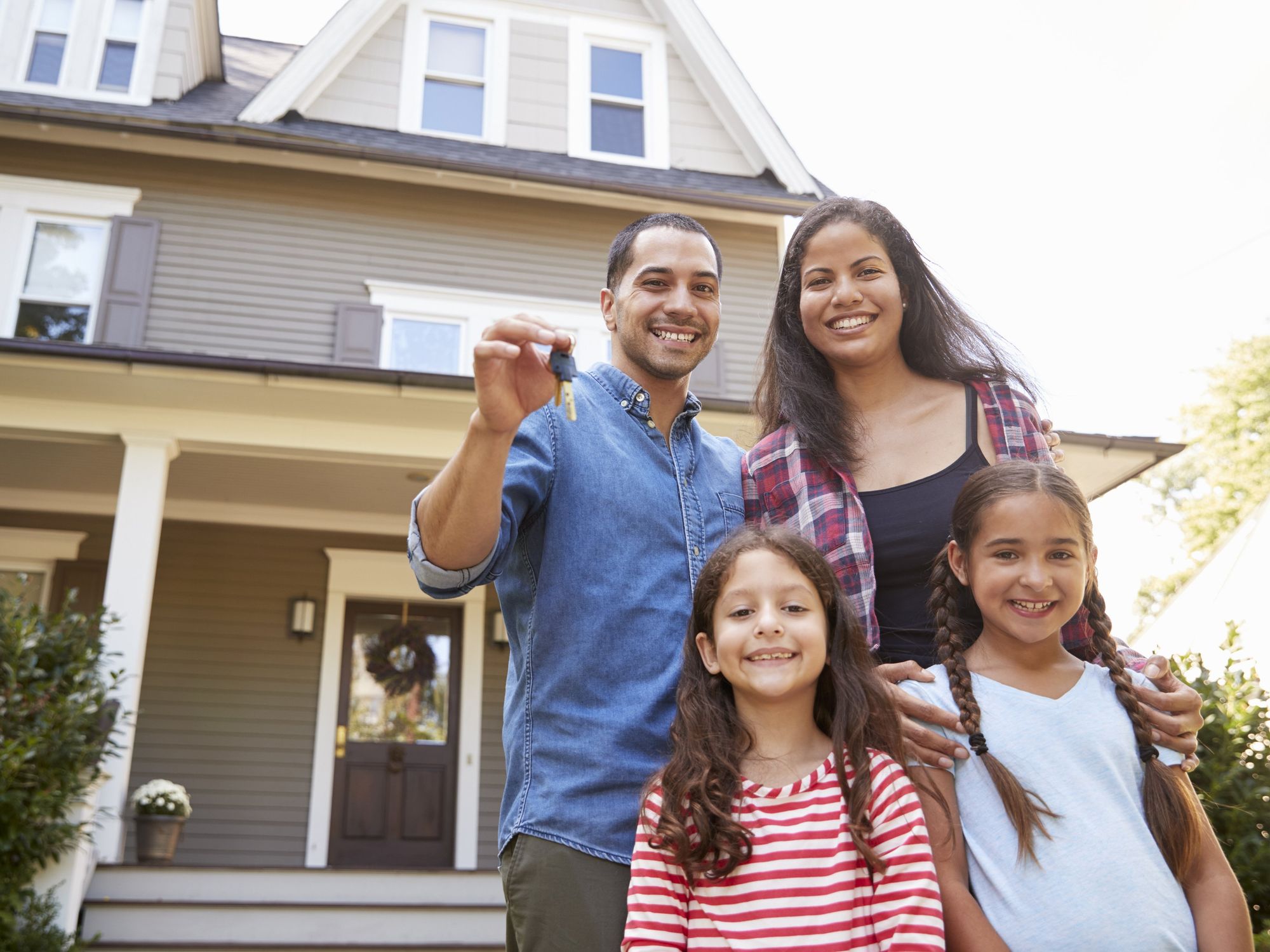 Family in front of house