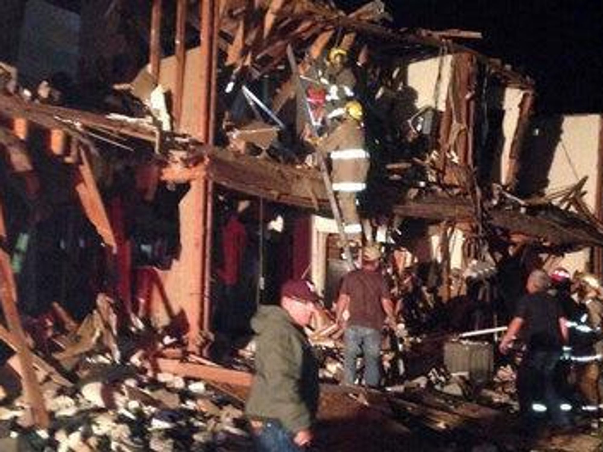Firefighters search through the rubble in West, Texas