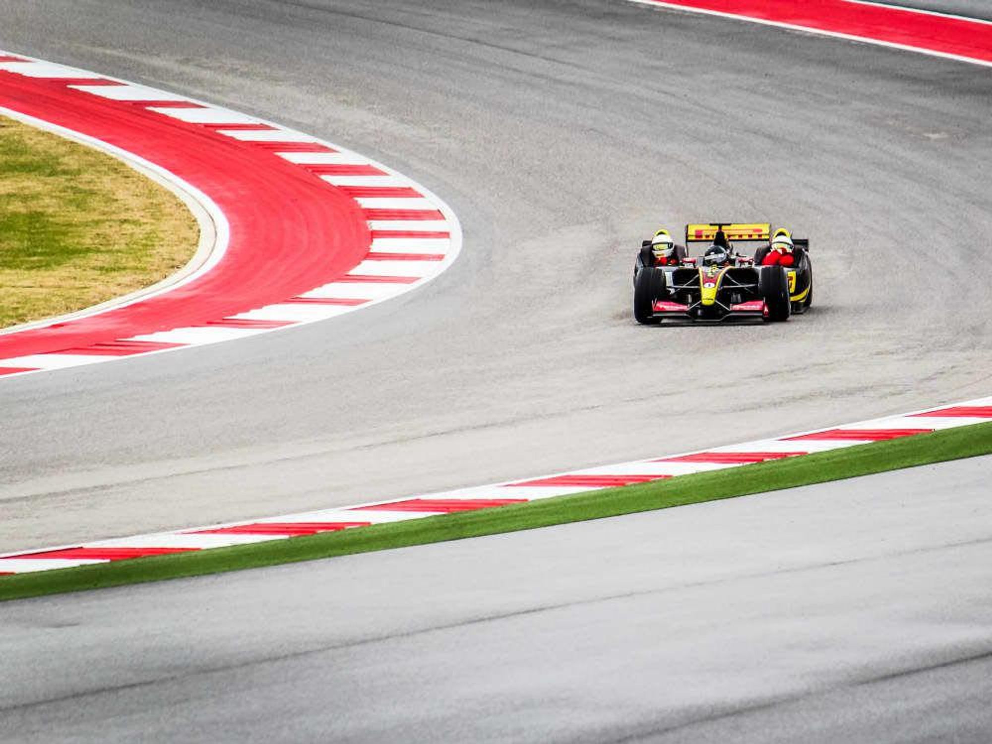 formula 1 ride along coming out of a turn for Ride Drive Give promotion