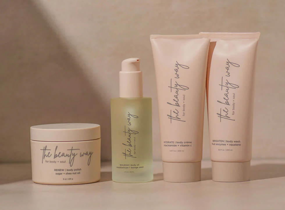 Four pastel pink products from The Beauty Way lined up side by side.