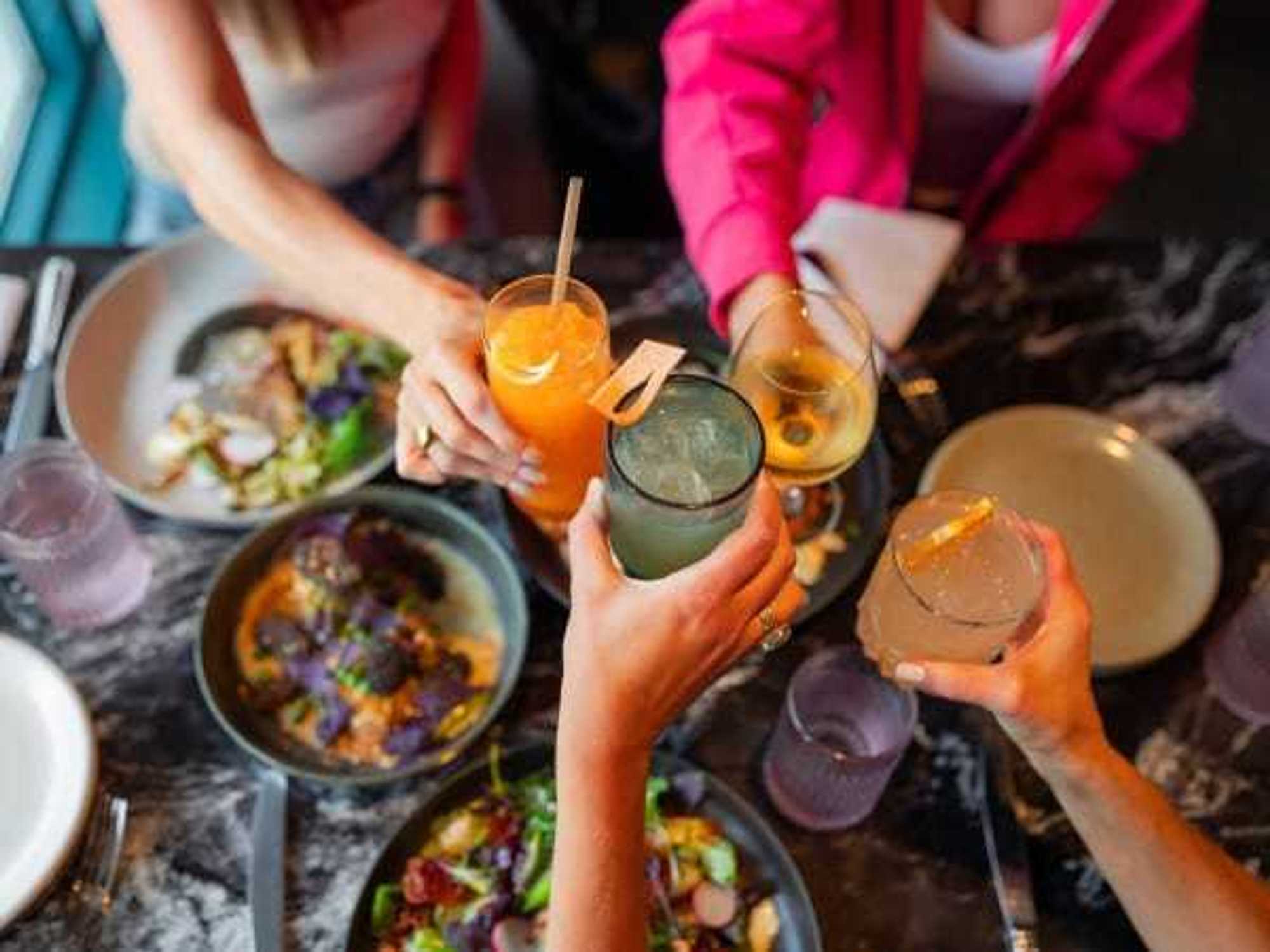 Friends sharing drinks and meal