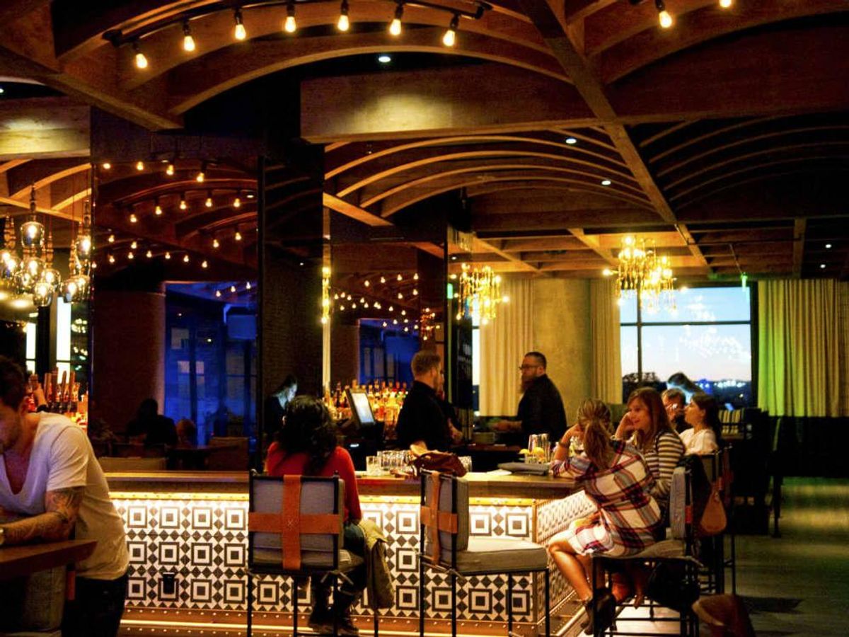 The extensive bar at the center of Geraldine's divides the lounge from