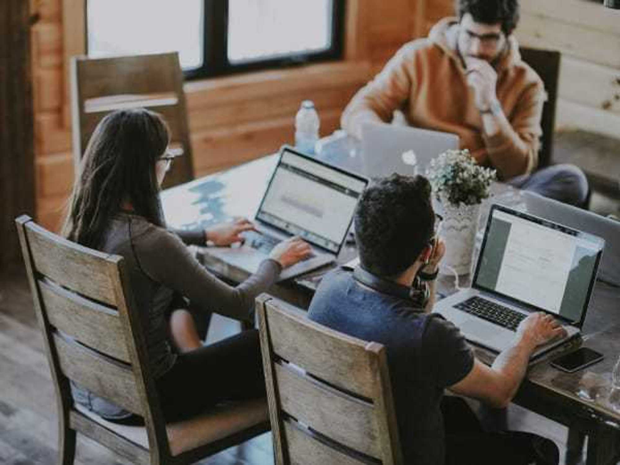 Group of people working on their laptops