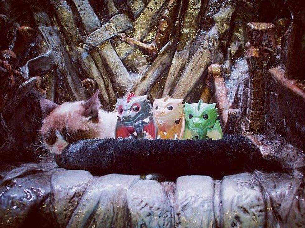 Grumpy Cat on the Iron Throne with toy dragons at Game of Thrones SXSW 2014 exhibit