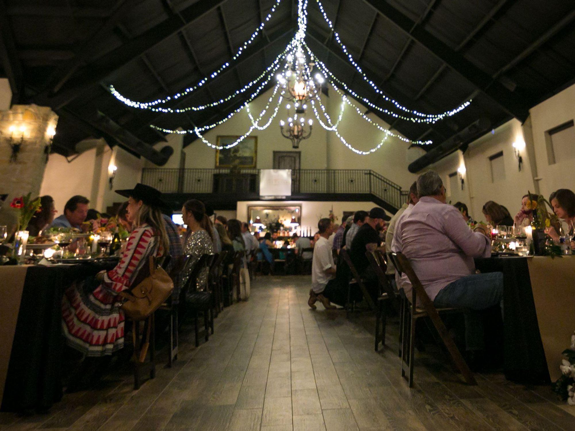 Guests at a seated dinner at the Butcher's Ball in Brenham, Texas.