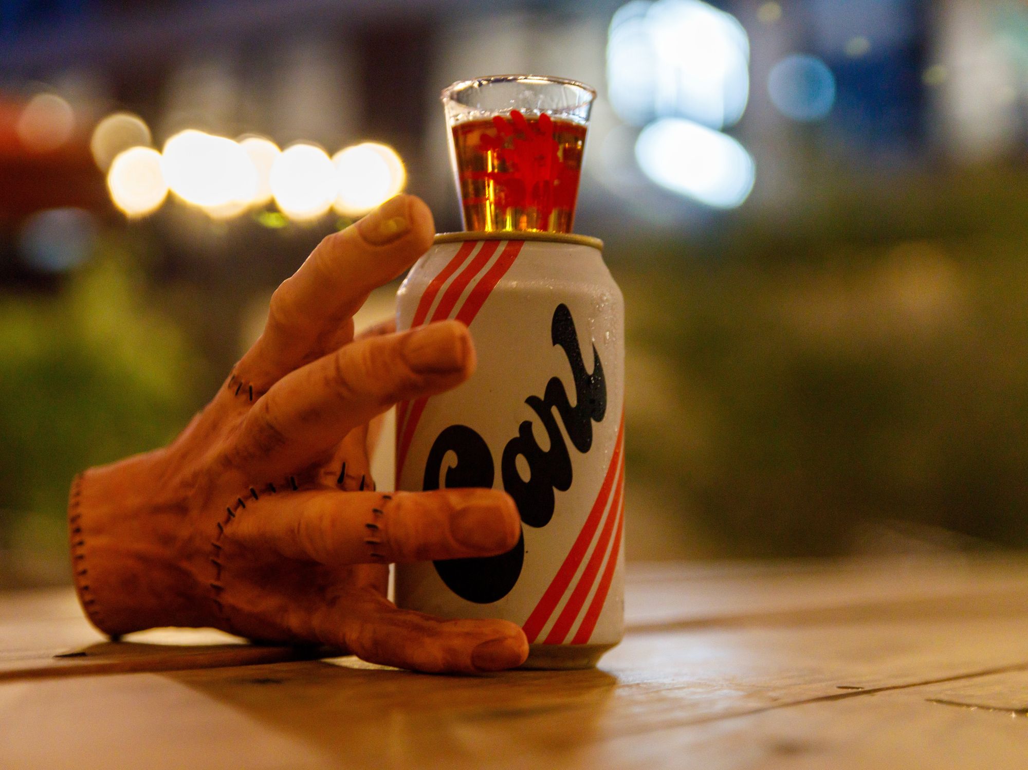 Hand with beer combo at Lefty's Brick Bar