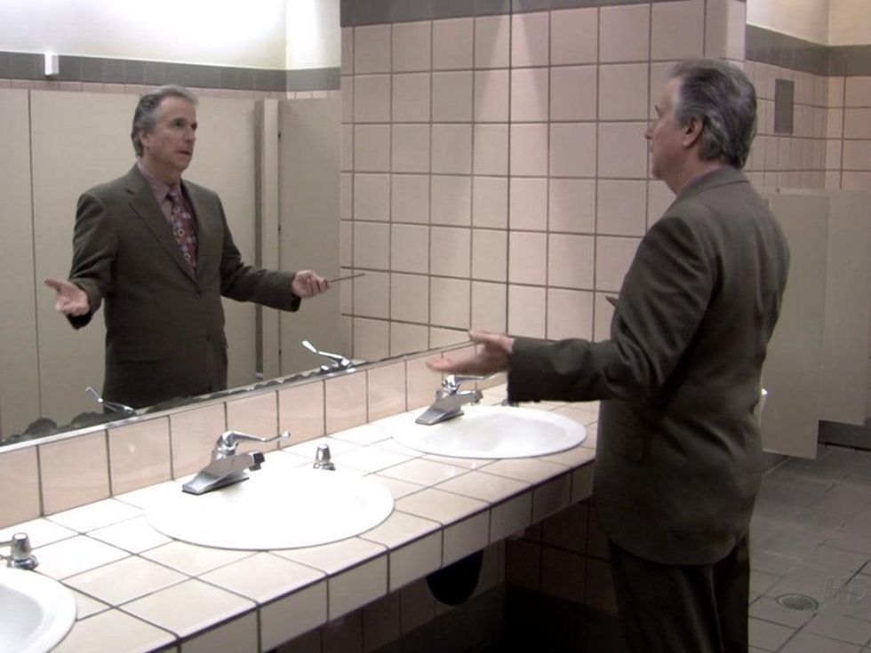 Henry Winkler doing the Fonz pose in a mirror in Arrested Development